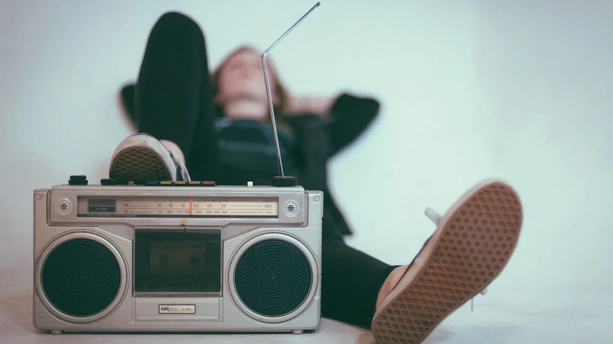 Modern microphone next to vintage radio representing online vs traditional